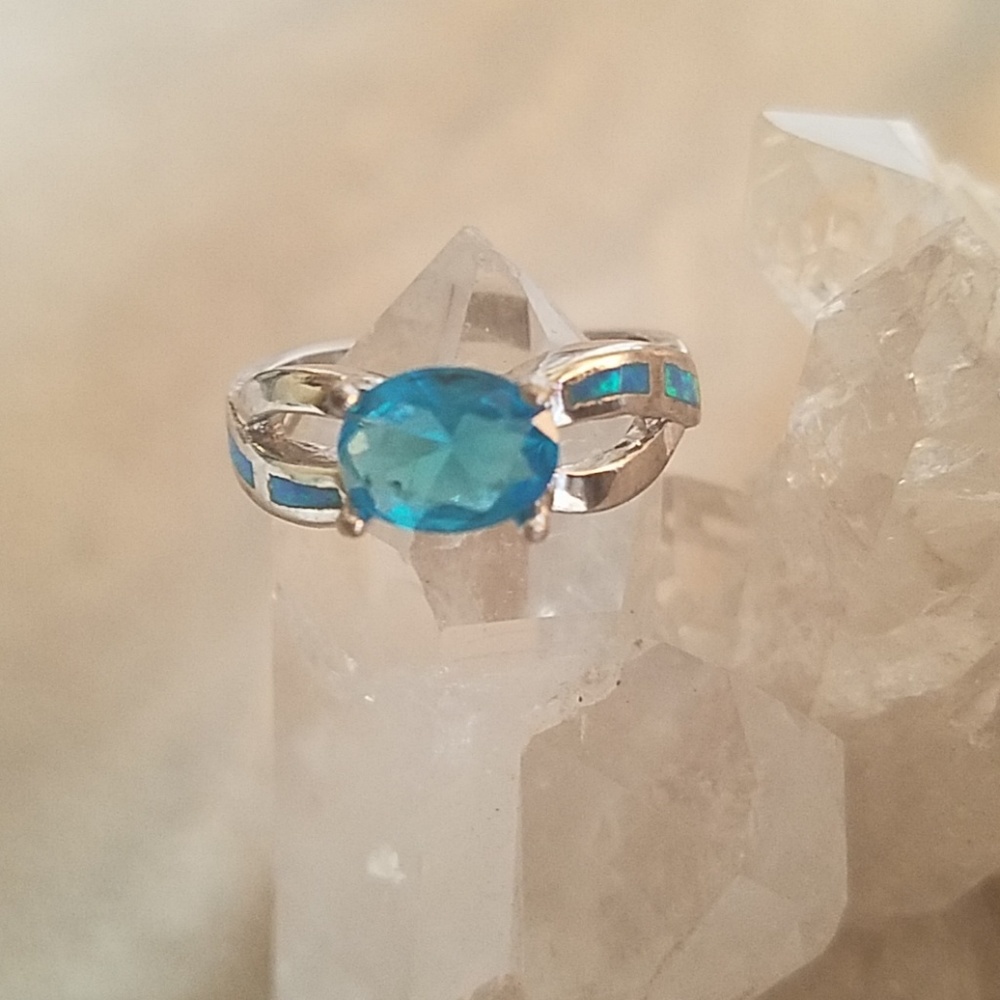 Blue topaz and fire opal ring